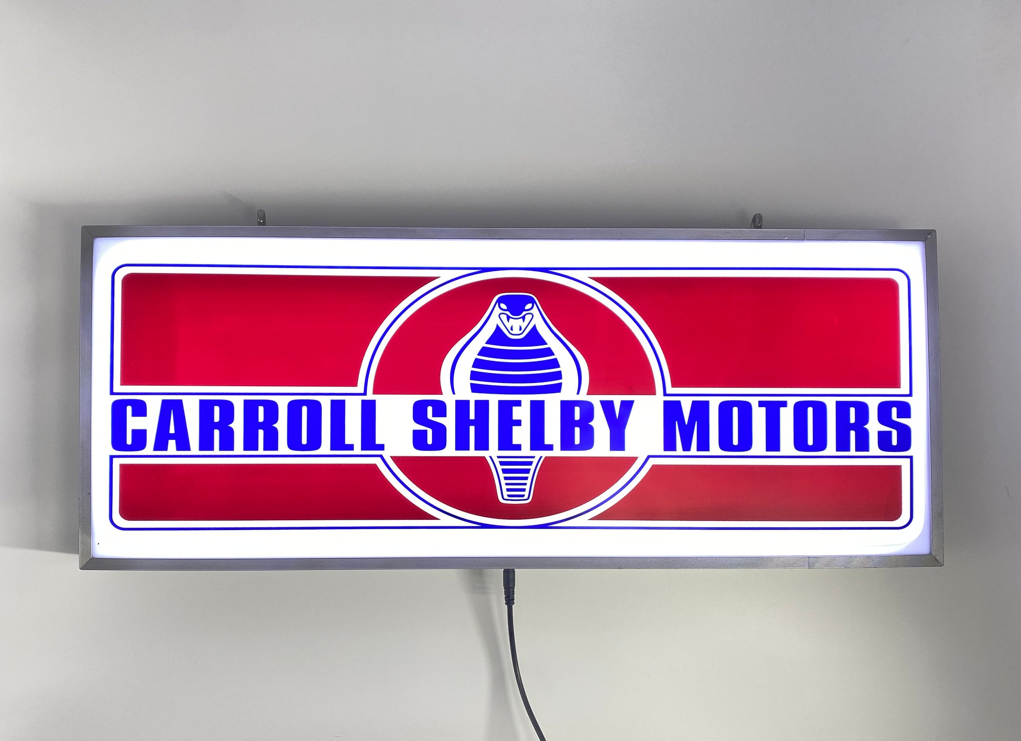 Close-up of Carroll Shelby Motors LED Sign with customizable lighting